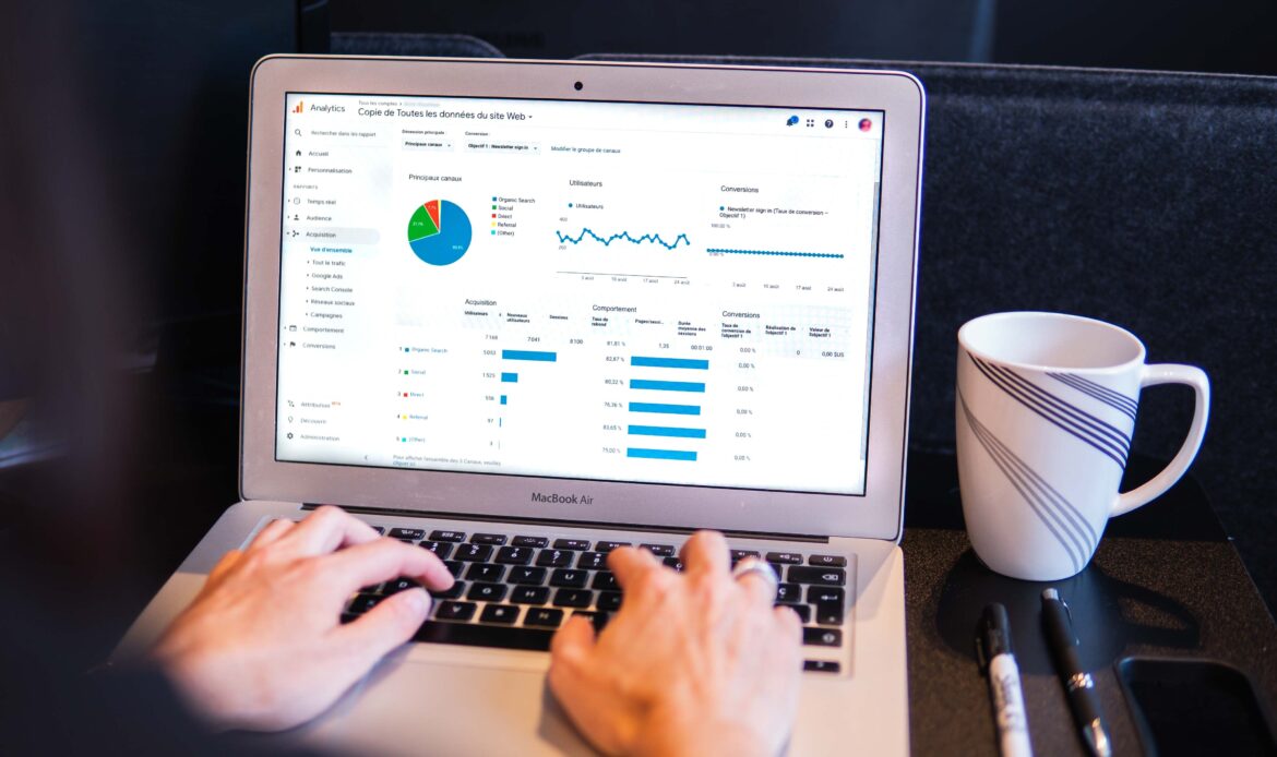 laptop with graphs on screen